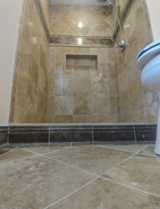 A walk-in shower that has been remodeled.