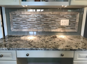 A new backsplash and countertop in a kitchen.