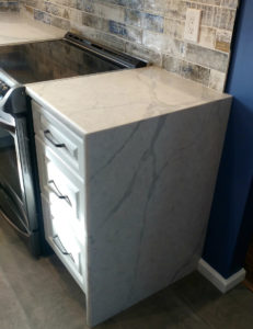 A new countertop and oven.