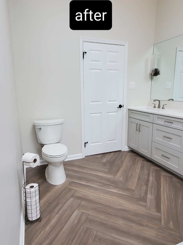 Renovated bathroom with a redesigned toilet area
