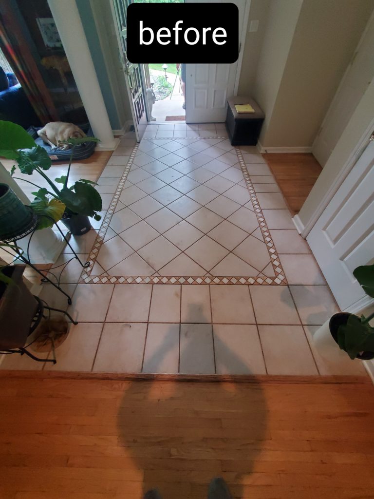 A home’s tile floor foyer prior to being renovated
